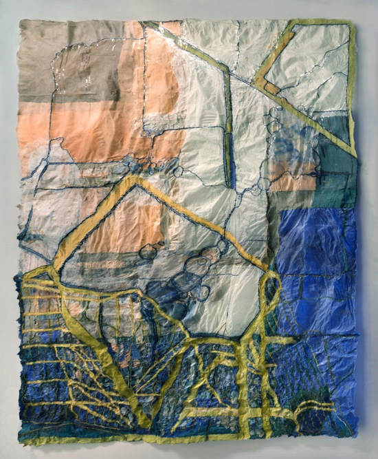 A square, textile based artwork, in blue, peach and yellow