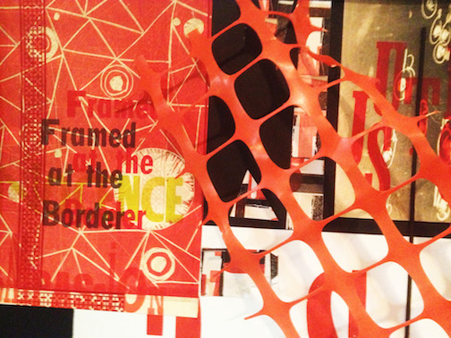 A collage made with found images featuring the text, "Framed at the border," and orange plastic fence material