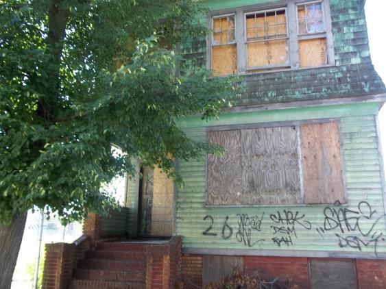 Photo of a boarded up house
