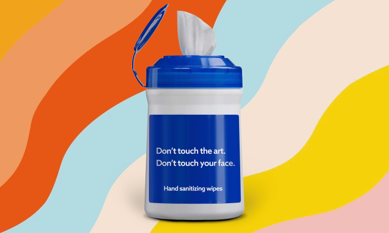 A container of wipes with the text, "Don't touch the art. Don't touch your face."